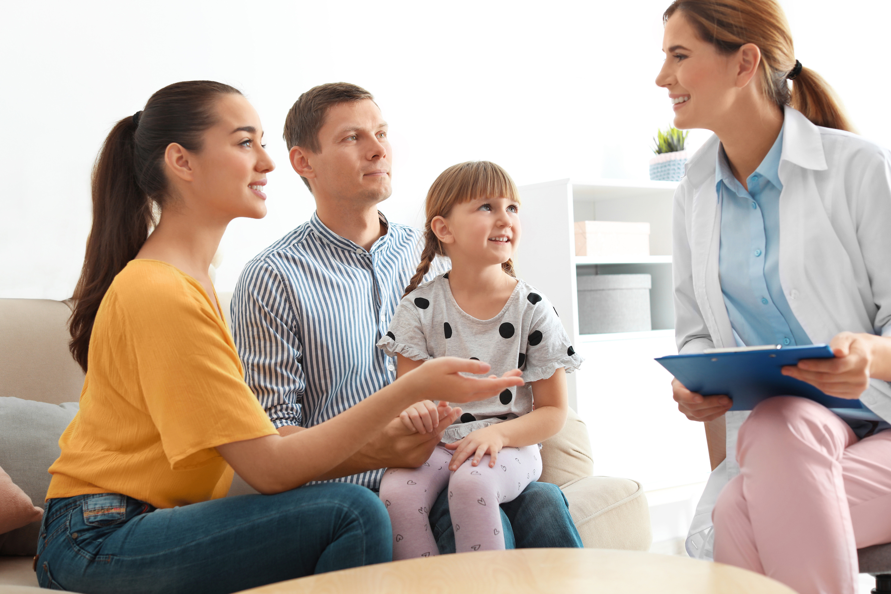 a young family speaking with a family medicine doctor