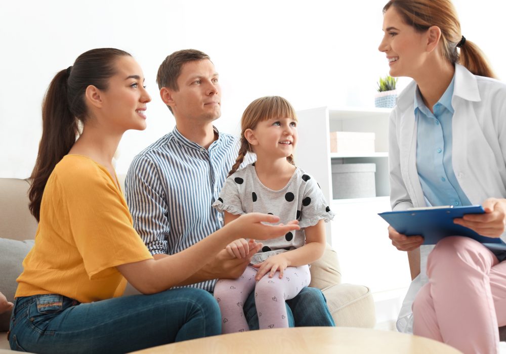 a young family speaking with a family medicine doctor