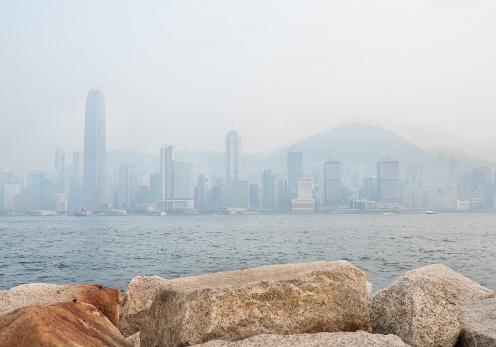 The skyscrapers of Hong Kong's financial district and Victoria Peak obscured by air pollution