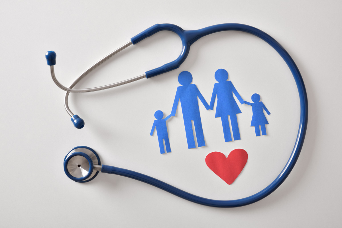 Blue paper cut-outs of a family and a stethoscope against a white background in El Paso.